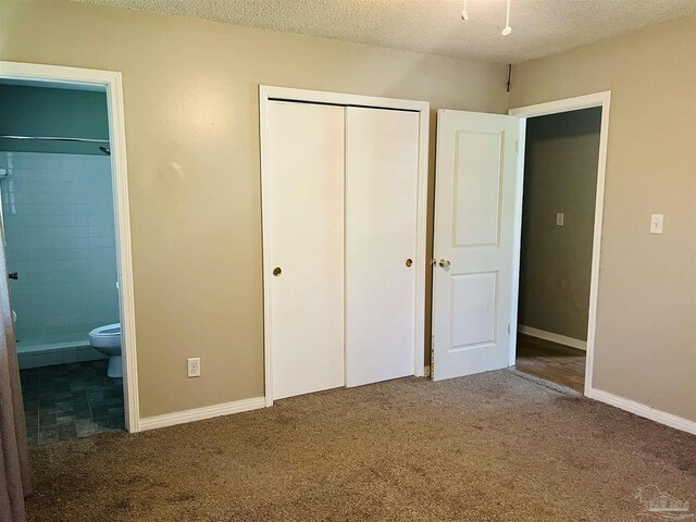 full bathroom with vanity, tile patterned floors, a textured ceiling, tiled shower / bath, and toilet