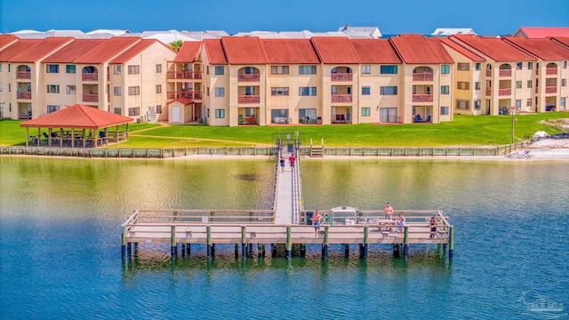 dock area with a gazebo and a water view