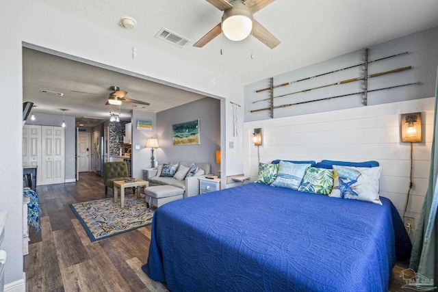 bedroom featuring dark hardwood / wood-style floors and ceiling fan