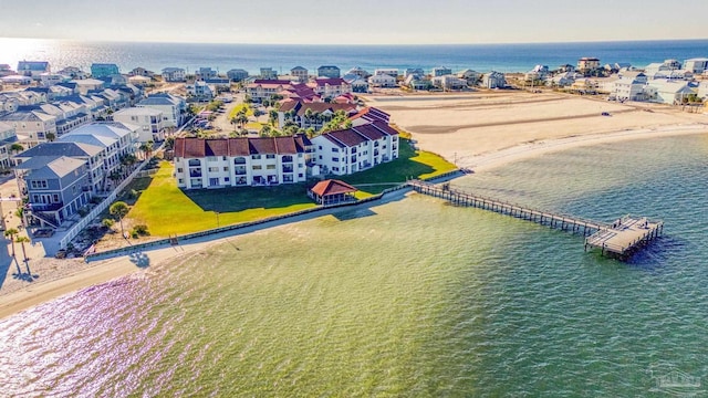 bird's eye view featuring a water view and a view of the beach