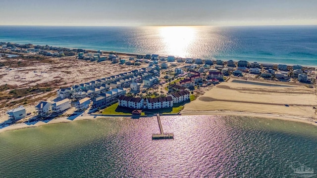 bird's eye view featuring a water view and a view of the beach