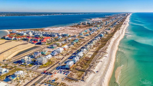 bird's eye view featuring a water view and a view of the beach