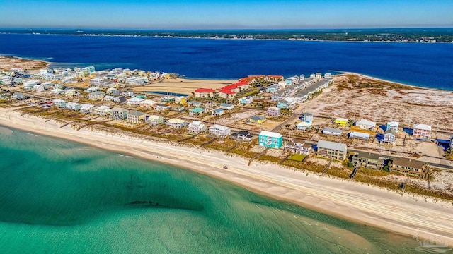 bird's eye view featuring a view of the beach and a water view