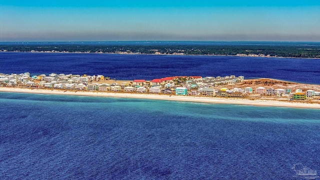 aerial view with a water view and a beach view