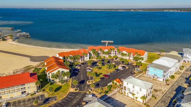 bird's eye view featuring a view of the beach and a water view