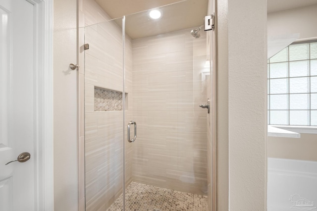 bathroom with an enclosed shower