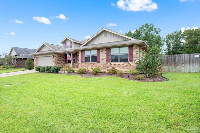 view of front of property featuring a garage and a front lawn