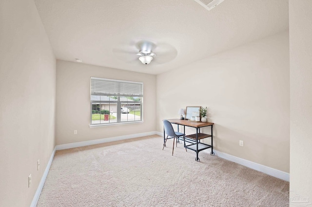 office with ceiling fan and light carpet