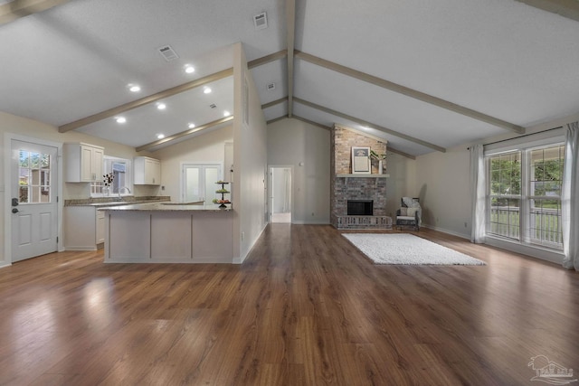 4507 Whisper Way, Pensacola, FL 32504 - unfurnished living room featuring a fireplace, wood finished floors, and recessed lighting