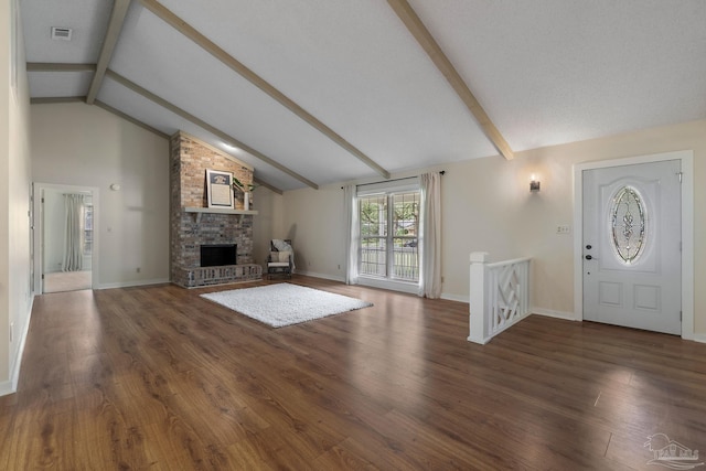 4507 Whisper Way, Pensacola, FL 32504 - unfurnished living room with beamed ceiling, a brick fireplace, wood finished floors, and high vaulted ceiling