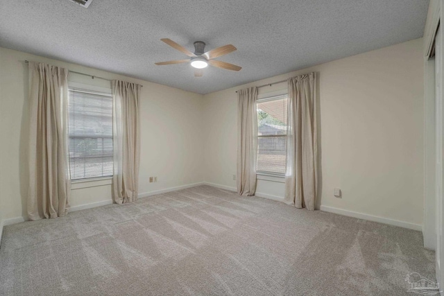 4507 Whisper Way, Pensacola, FL 32504 - spare room featuring ceiling fan, carpet flooring, and a textured ceiling