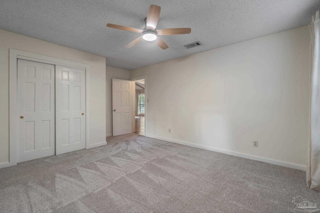 4507 Whisper Way, Pensacola, FL 32504 - unfurnished bedroom featuring carpet, a textured ceiling, a closet, and ceiling fan
