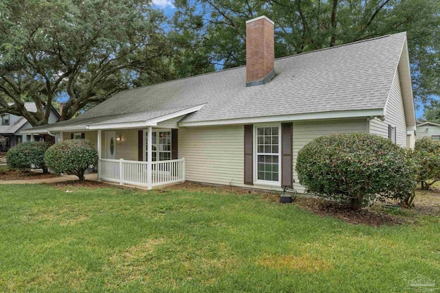 4507 Whisper Way, Pensacola, FL 32504 - view of front facade with a porch, a chimney, a shingled roof, and a front yard