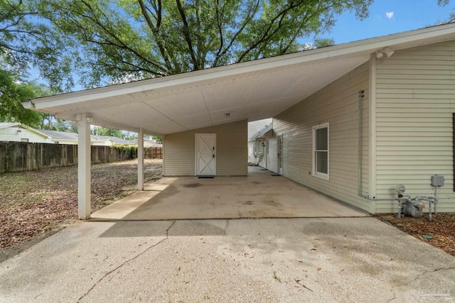 4507 Whisper Way, Pensacola, FL 32504 - view of vehicle parking featuring driveway and a carport
