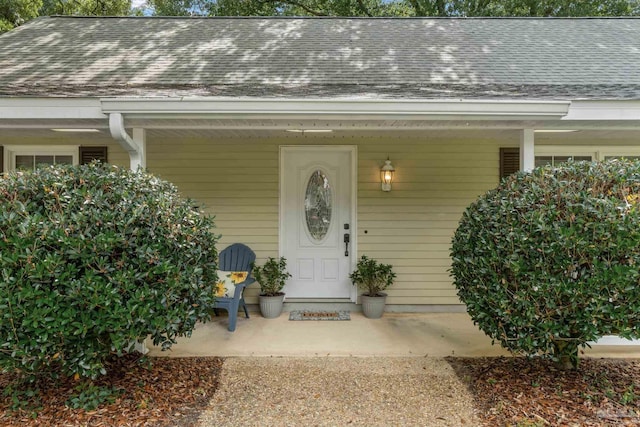 4507 Whisper Way, Pensacola, FL 32504 - view of exterior entry with covered porch and roof with shingles