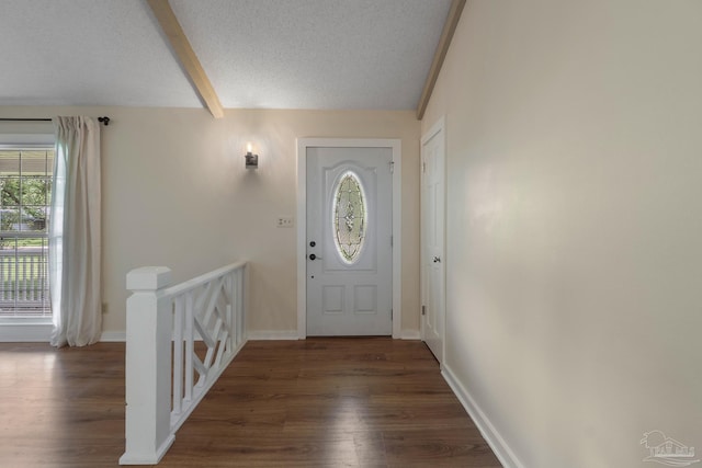 4507 Whisper Way, Pensacola, FL 32504 - entryway with wood finished floors, plenty of natural light, beam ceiling, and a textured ceiling