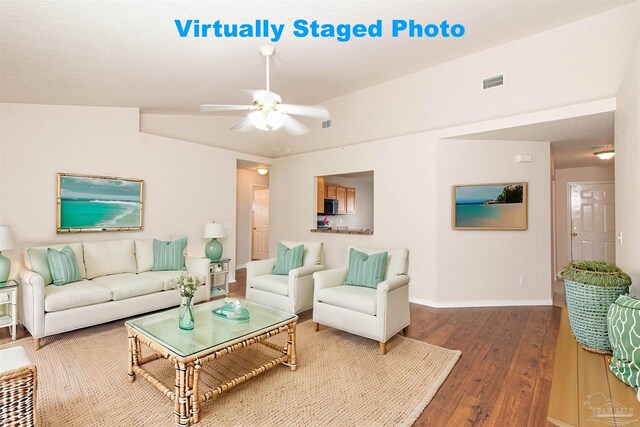 living room featuring ceiling fan, lofted ceiling, and dark wood-type flooring