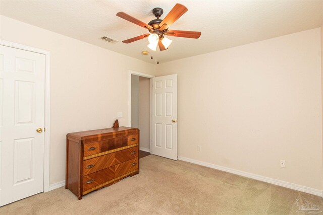 bedroom featuring ceiling fan and light colored carpet