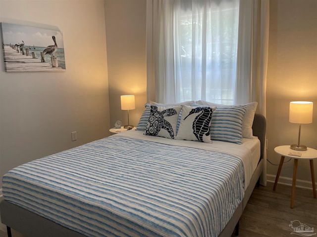 bedroom with hardwood / wood-style floors