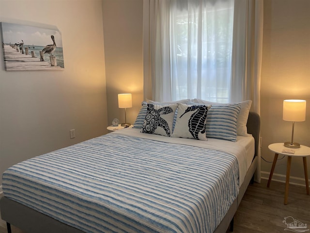 bedroom featuring dark hardwood / wood-style flooring