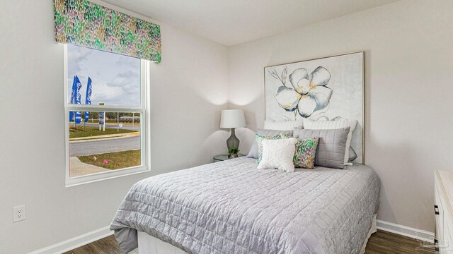 6329 Firefly Dr, Milton, FL 32583 - bedroom featuring wood finished floors and baseboards