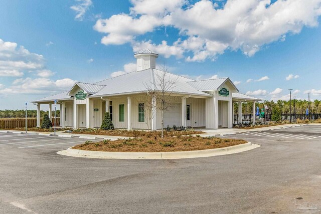 6329 Firefly Dr, Milton, FL 32583 - view of building exterior with fence and uncovered parking