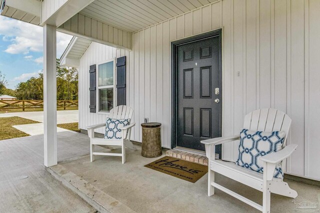 6329 Firefly Dr, Milton, FL 32583 - doorway to property with covered porch