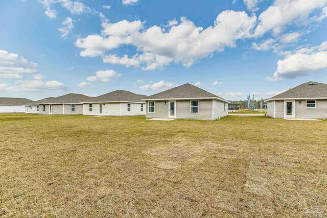 6329 Firefly Dr, Milton, FL 32583 - back of house with a lawn