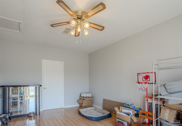 interior space with ceiling fan and light wood-type flooring