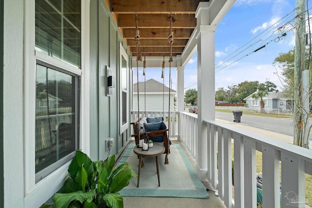 balcony with a sunroom and a porch