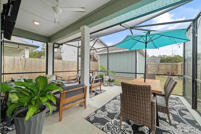 sunroom / solarium with ceiling fan