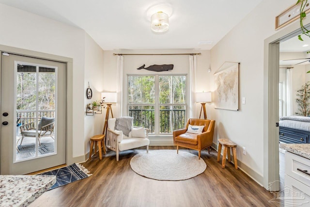 1058 Iron Forge Rd, Cantonment, FL 32533 - living area featuring plenty of natural light, wood finished floors, and baseboards