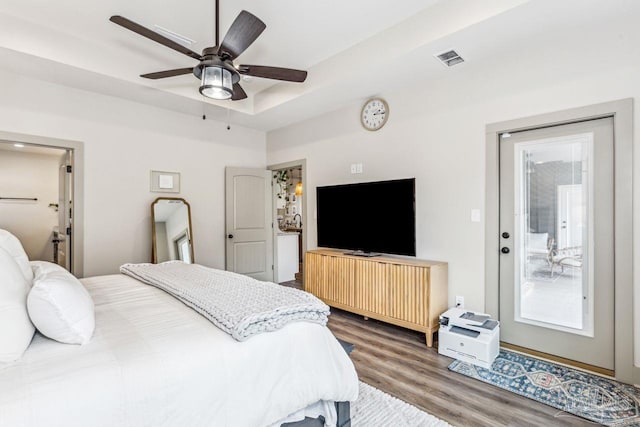 1058 Iron Forge Rd, Cantonment, FL 32533 - bedroom featuring wood finished floors, access to exterior, and ceiling fan