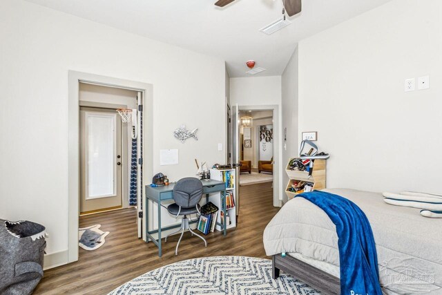 1058 Iron Forge Rd, Cantonment, FL 32533 - bedroom with wood finished floors, a ceiling fan, and baseboards