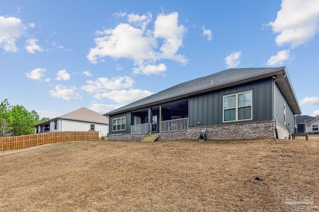 1058 Iron Forge Rd, Cantonment, FL 32533 - view of front of home with board and batten siding, fence, and a shingled roof