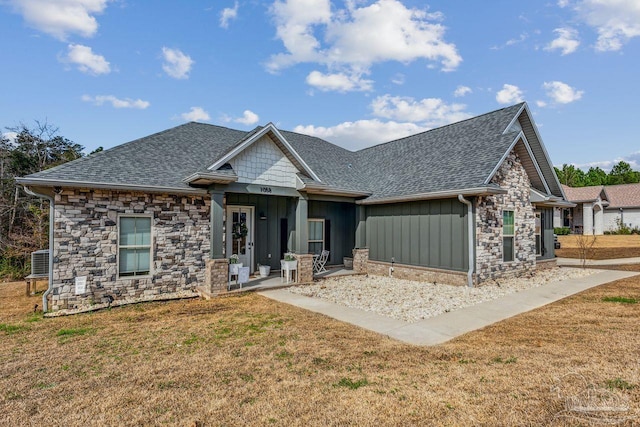 1058 Iron Forge Rd, Cantonment, FL 32533 - craftsman house featuring stone siding, roof with shingles, and a front yard