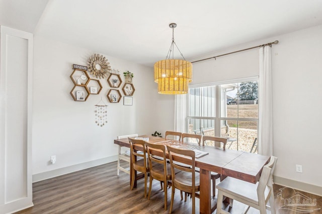 1058 Iron Forge Rd, Cantonment, FL 32533 - dining space featuring a chandelier, wood finished floors, and baseboards