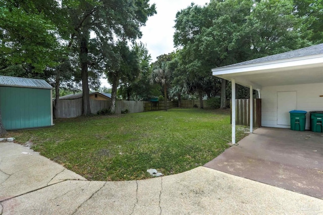 316 Dolphin St, Gulf Breeze, FL 32561 - view of yard with an outdoor structure, a shed, and a carport
