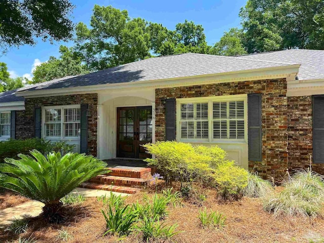 316 Dolphin St, Gulf Breeze, FL 32561 - view of front of home with a shingled roof and brick siding