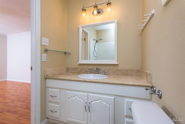 316 Dolphin St, Gulf Breeze, FL 32561 - bathroom featuring vanity, wood finished floors, toilet, and a shower