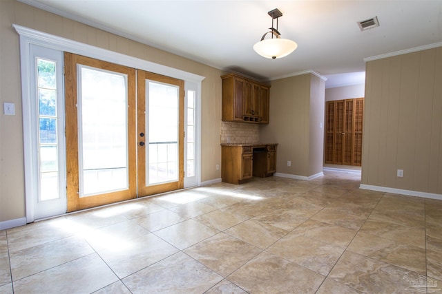 316 Dolphin St, Gulf Breeze, FL 32561 - unfurnished living room with french doors, baseboards, and ornamental molding
