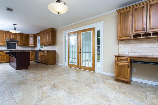 316 Dolphin St, Gulf Breeze, FL 32561 - kitchen featuring dishwasher, french doors, tasteful backsplash, brown cabinetry, and ornamental molding