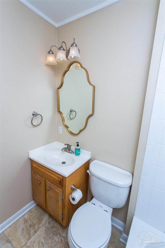 316 Dolphin St, Gulf Breeze, FL 32561 - bathroom featuring toilet, vanity, baseboards, and a tile shower