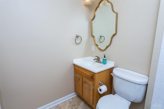 316 Dolphin St, Gulf Breeze, FL 32561 - bathroom with toilet, vanity, and baseboards