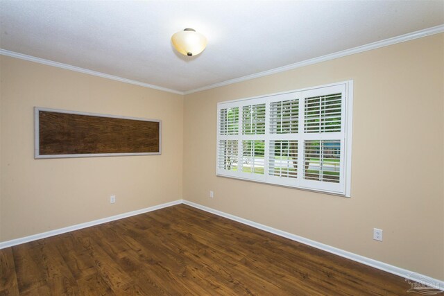 316 Dolphin St, Gulf Breeze, FL 32561 - spare room featuring baseboards, crown molding, and dark wood-style floors