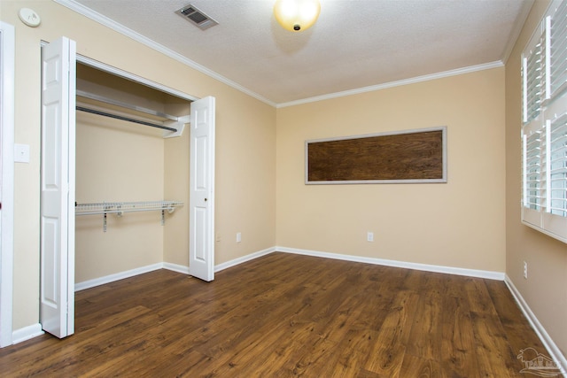 316 Dolphin St, Gulf Breeze, FL 32561 - unfurnished bedroom featuring wood finished floors, ornamental molding, a closet, and baseboards