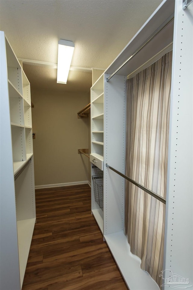 316 Dolphin St, Gulf Breeze, FL 32561 - spacious closet featuring dark wood-style flooring