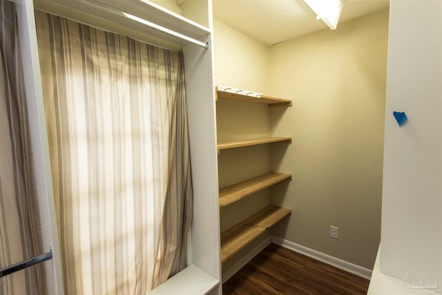 316 Dolphin St, Gulf Breeze, FL 32561 - spacious closet with dark wood finished floors