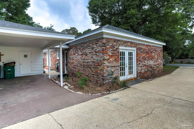 316 Dolphin St, Gulf Breeze, FL 32561 - view of side of property featuring french doors and brick siding