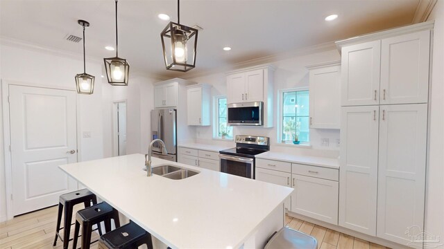 living room with light hardwood / wood-style floors, ceiling fan, and sink